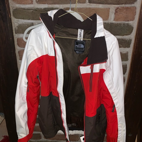 red and white north face jacket